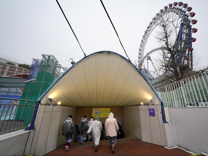 Participants take refuge underground during an evacuation drill simulating a North Korea ballistic missile attack Monday in Tokyo. Participants take refuge underground during an evacuation drill simulating a North Korea ballistic missile attack Monday in Tokyo.