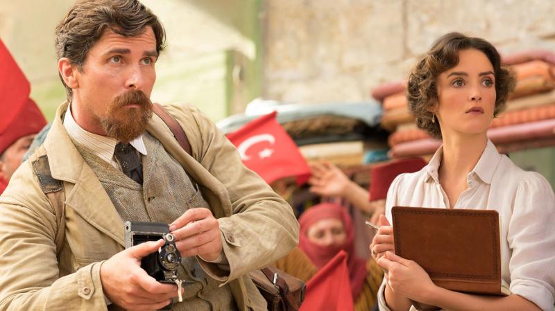 Chris (Christian Bale) and Ana (Charlotte Le Bon) have a reason to look worried in Terry George's The Promise. Chris (Christian Bale) and Ana (Charlotte Le Bon) have a reason to look worried in Terry George's The Promise.