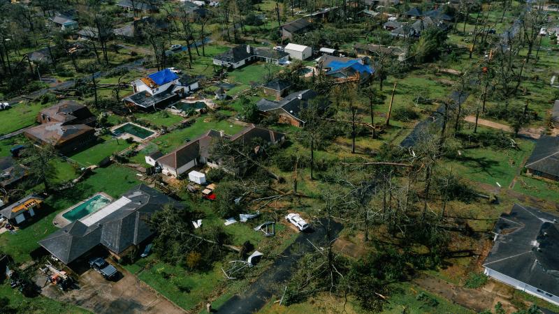 An aerial view of Lake Charles, La., shows damage to houses last week after Hurricane Laura, one of the most powerful storms ever to hit Louisiana, tore through the area. An aerial view of Lake Charles, La., shows damage to houses last week after Hurricane Laura, one of the most powerful storms ever to hit Louisiana, tore through the area.
