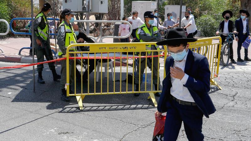 Israeli security forces control access to a neighborhood that has been isolated following an increase in coronavirus cases in the southern coastal city of Ashdod last week. Israeli security forces control access to a neighborhood that has been isolated following an increase in coronavirus cases in the southern coastal city of Ashdod last week.