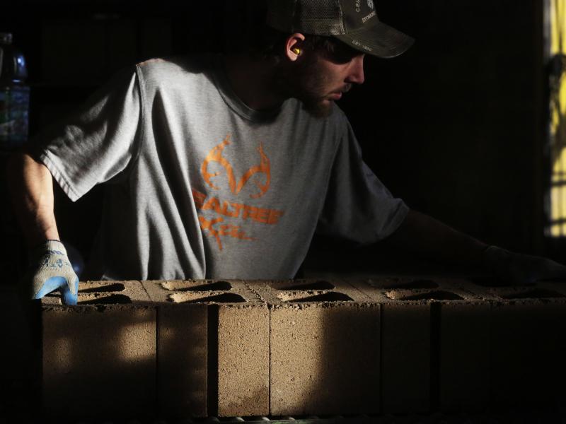 An employee moves cement blocks at the Cement Products Manufacturing Co. facility in Redmond, Ore. Millions of men in their prime working years have dropped out of the labor force since the 1960s. An employee moves cement blocks at the Cement Products Manufacturing Co. facility in Redmond, Ore. Millions of men in their prime working years have dropped out of the labor force since the 1960s.