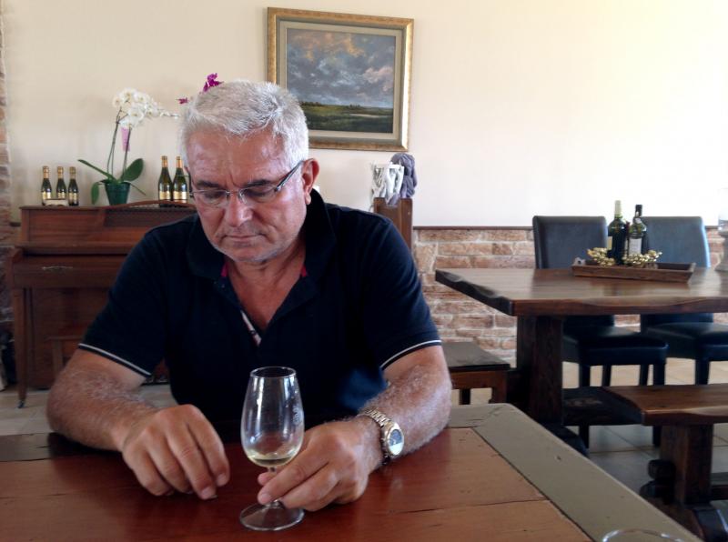 Petros Hatzigeorgiou, whose family has been making wine for more than 150 years, at his winery outside the village of Atsiki, Lemnos. He says islanders can weather the tax by working harder. "That's how we can fight it, no matter how much it hurts," he sa Petros Hatzigeorgiou, whose family has been making wine for more than 150 years, at his winery outside the village of Atsiki, Lemnos. He says islanders can weather the tax by working harder. "That's how we can fight it, no matter how much it hurts," he sa