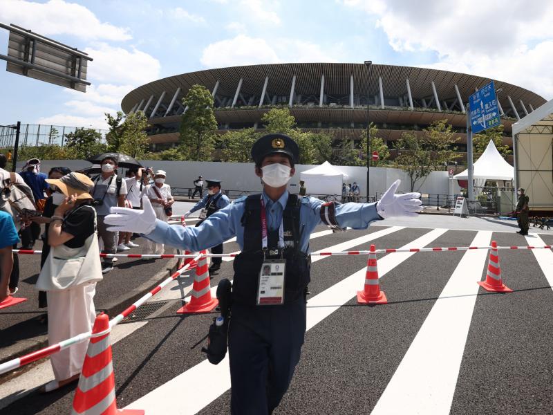 Police manage the crowd outside the Olympic Stadium in Tokyo on July 23, 2021, ahead of the opening ceremony of the 2020 Tokyo Olympic Games. Police manage the crowd outside the Olympic Stadium in Tokyo on July 23, 2021, ahead of the opening ceremony of the 2020 Tokyo Olympic Games.