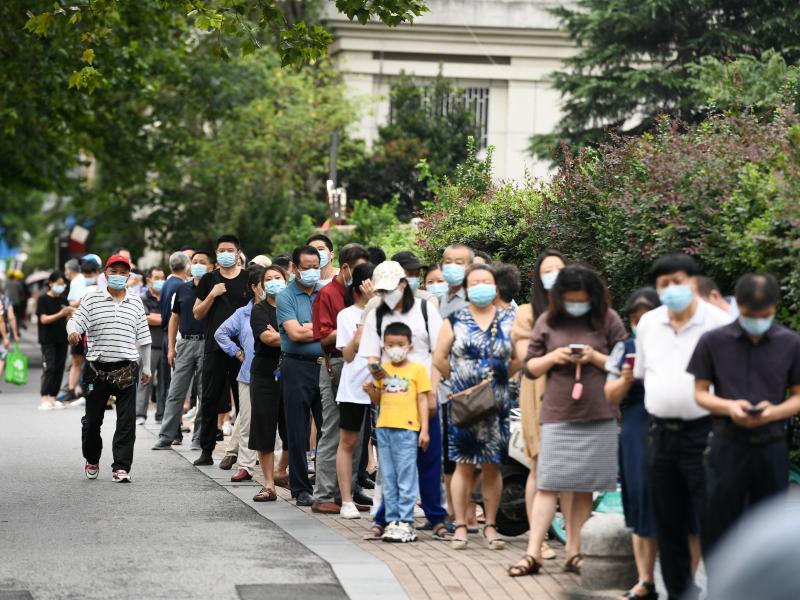 People line up for coronavirus testing on Thursday in Nanjing, in China's Jiangsu province. People line up for coronavirus testing on Thursday in Nanjing, in China's Jiangsu province.