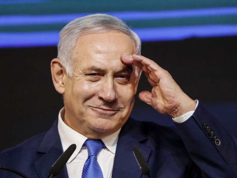 Israeli Prime Minister Benjamin Netanyahu gestures as he addresses supporters at his Likud Party headquarters in Tel Aviv on election night early on Wednesday. Israeli Prime Minister Benjamin Netanyahu gestures as he addresses supporters at his Likud Party headquarters in Tel Aviv on election night early on Wednesday.