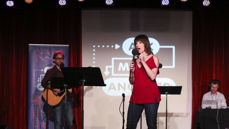 Ophira Eisenberg performs on stage on Ask Me Another at the Bell House in Brooklyn, New York. Ophira Eisenberg performs on stage on Ask Me Another at the Bell House in Brooklyn, New York.