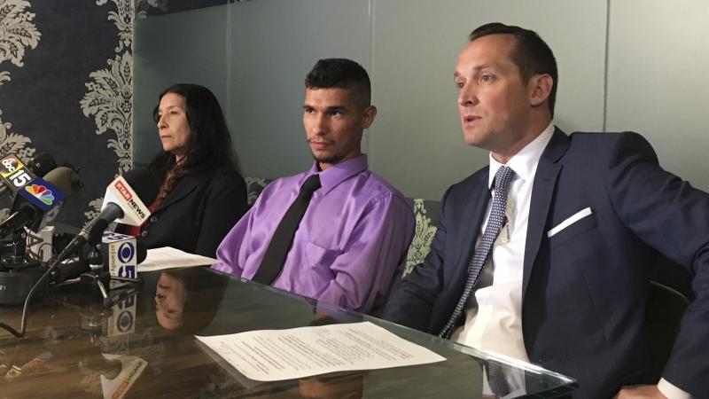 Jose Luis Conde (center) listens to news media while seated between his mother, Rosa Conde, and his attorney Bret Royle at Royle's office in Phoenix on Thursday. Royle released Mesa police body cam videos showing officers punching Conde, who was unarmed, Jose Luis Conde (center) listens to news media while seated between his mother, Rosa Conde, and his attorney Bret Royle at Royle's office in Phoenix on Thursday. Royle released Mesa police body cam videos showing officers punching Conde, who was unarmed,