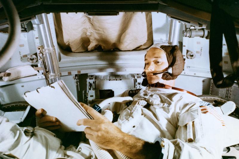 Collins studies the flight plan during simulation training at the Kennedy Space Center before the scheduled Apollo 11 mission. Collins studies the flight plan during simulation training at the Kennedy Space Center before the scheduled Apollo 11 mission.