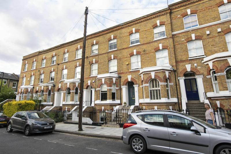 The road in Clapham, south London, where a body fell from a passenger plane and was found in a garden. Police say the victim may have been a man who stowed away in the plane's landing gear. The road in Clapham, south London, where a body fell from a passenger plane and was found in a garden. Police say the victim may have been a man who stowed away in the plane's landing gear.