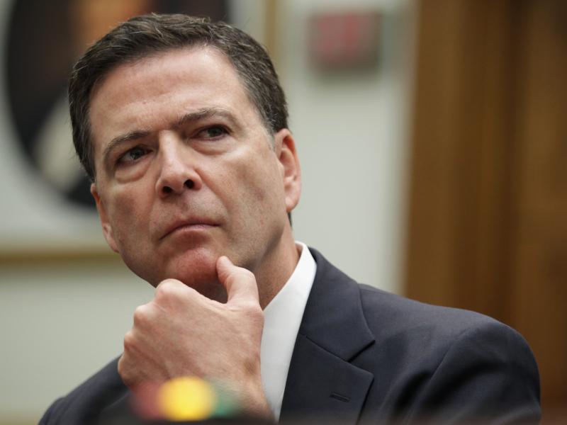 FBI Director James Comey says new encryption features allow people "to place themselves beyond the law." FBI Director James Comey says new encryption features allow people "to place themselves beyond the law."