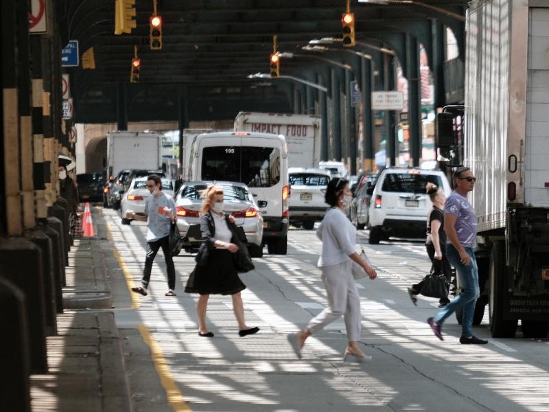 People walk along a main street in Brighton Beach, Brooklyn on Thursday in New York City. People walk along a main street in Brighton Beach, Brooklyn on Thursday in New York City.