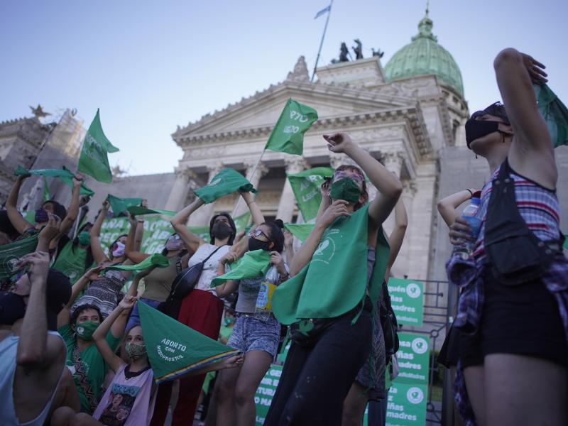 Abortion-rights activists in favor of a bill legalizing abortion gather outside the legislative building in Buenos Aires, Argentina, on Thursday. Abortion-rights activists in favor of a bill legalizing abortion gather outside the legislative building in Buenos Aires, Argentina, on Thursday.