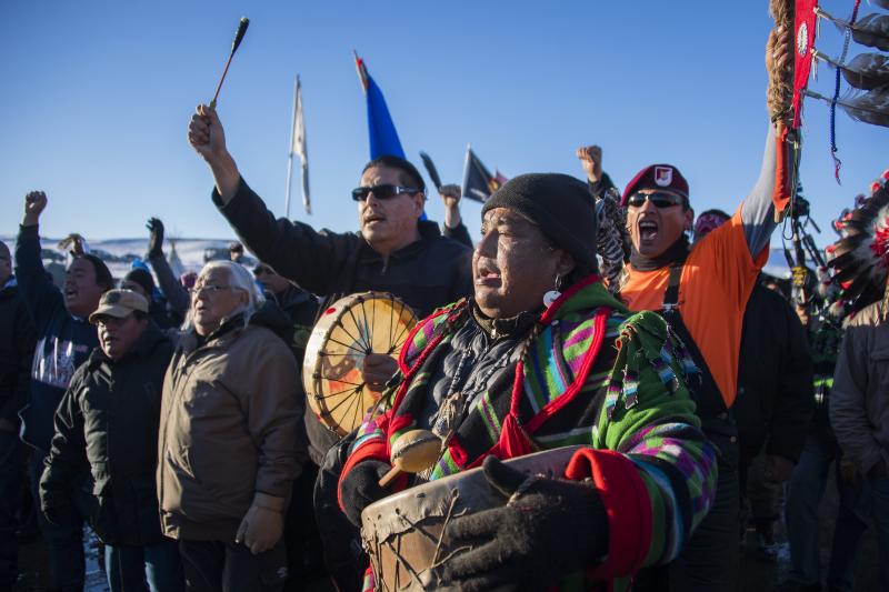 Protesters celebrate at Oceti Sakowin Camp earlier Sunday. The Army Corps of Engineers notified the Standing Rock Sioux that the current route for the Dakota Access Pipeline will be denied. Protesters celebrate at Oceti Sakowin Camp earlier Sunday. The Army Corps of Engineers notified the Standing Rock Sioux that the current route for the Dakota Access Pipeline will be denied.