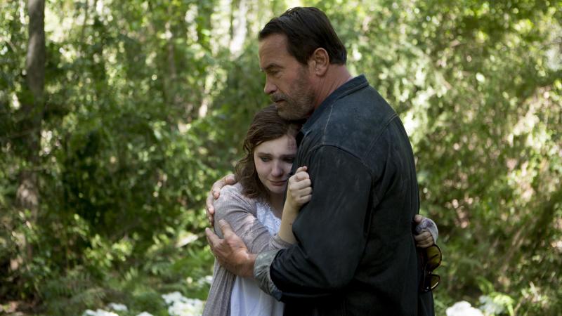 Abigail Breslin and Arnold Schwarzenegger in Maggie. Abigail Breslin and Arnold Schwarzenegger in Maggie.