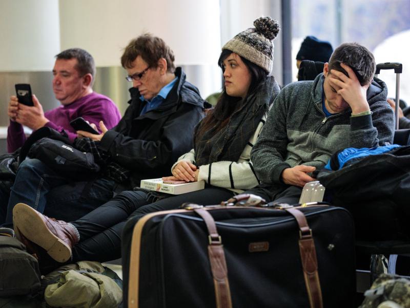 Passengers wait Friday at London's Gatwick Airport, where drone sightings repeatedly caused flights to be delayed and suspended at the height of holiday travel season. Passengers wait Friday at London's Gatwick Airport, where drone sightings repeatedly caused flights to be delayed and suspended at the height of holiday travel season.