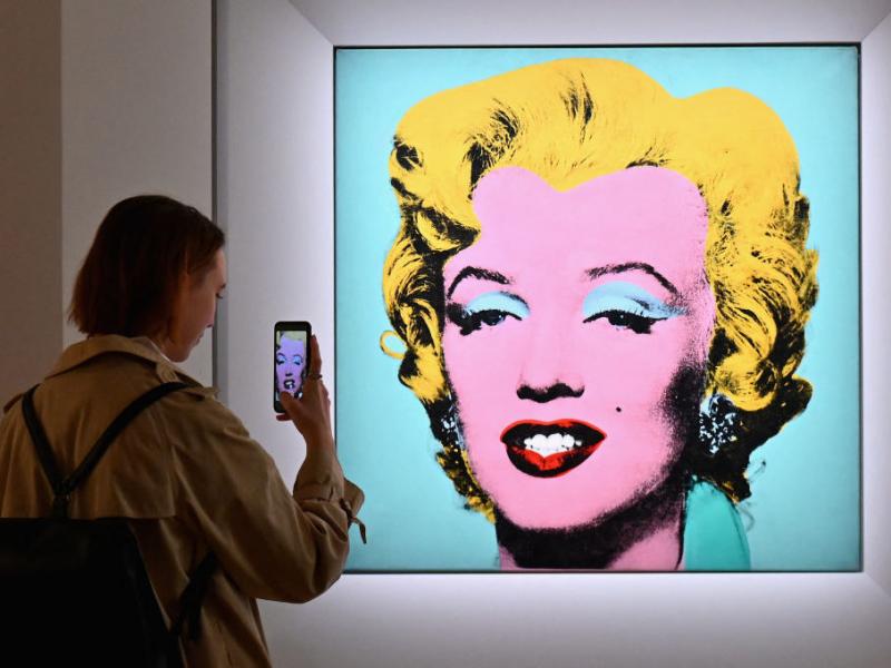 A woman takes a photo of Andy Warhol's 'Shot Sage Blue Marilyn' on April 29 during Christie's 20th and 21st Century Art press preview in New York City. A woman takes a photo of Andy Warhol's 'Shot Sage Blue Marilyn' on April 29 during Christie's 20th and 21st Century Art press preview in New York City.