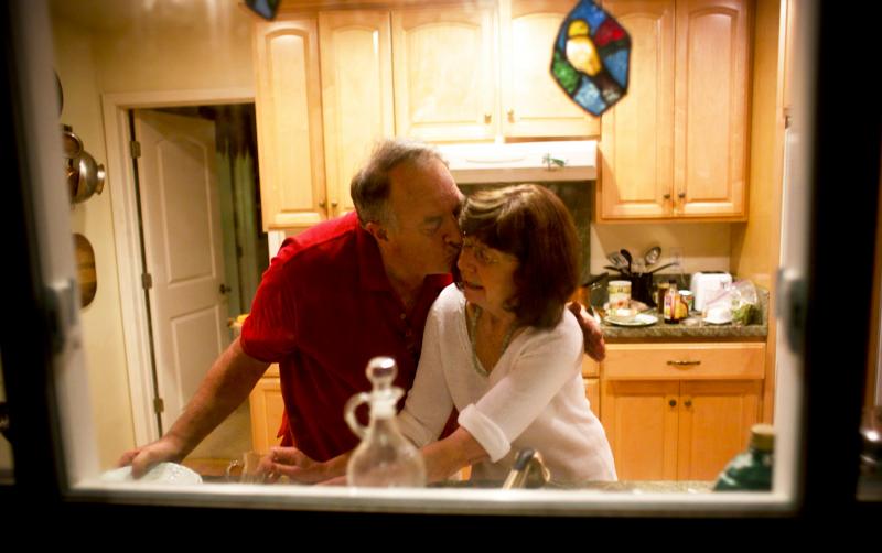 Rick and Marianne wash dishes together. She no longer remembers that he is her husband. Rick and Marianne wash dishes together. She no longer remembers that he is her husband.