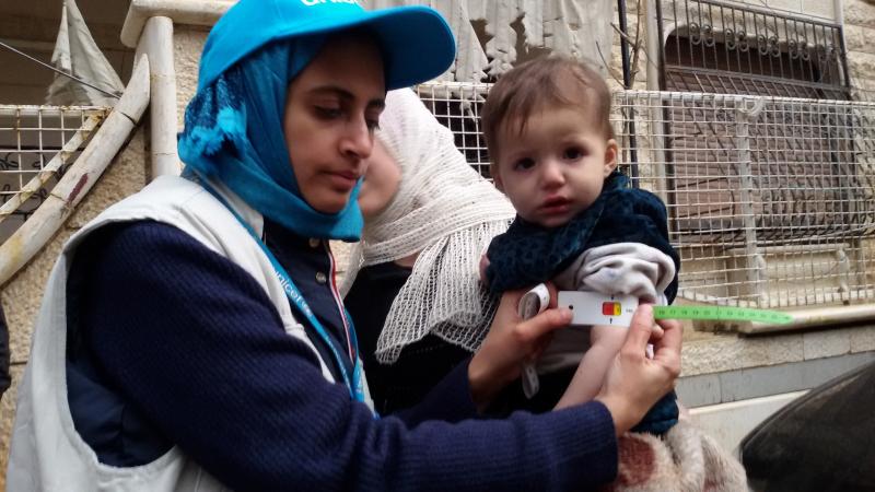 Dr. Rajia Sharhan, UNICEF Nutrition Specialist, takes a child's mid-upper arm circumference in Madaya, Syria, on Thursday. The city was under siege by government forces and didn't receive aid for months. Dozens of people have died of malnutrition. Dr. Rajia Sharhan, UNICEF Nutrition Specialist, takes a child's mid-upper arm circumference in Madaya, Syria, on Thursday. The city was under siege by government forces and didn't receive aid for months. Dozens of people have died of malnutrition.