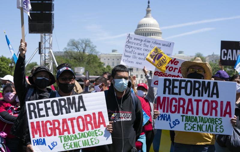 Immigration rights supporters rally Saturday on the National Mall in Washington, D.C., demanding citizenship for essential workers. Immigration rights supporters rally Saturday on the National Mall in Washington, D.C., demanding citizenship for essential workers.