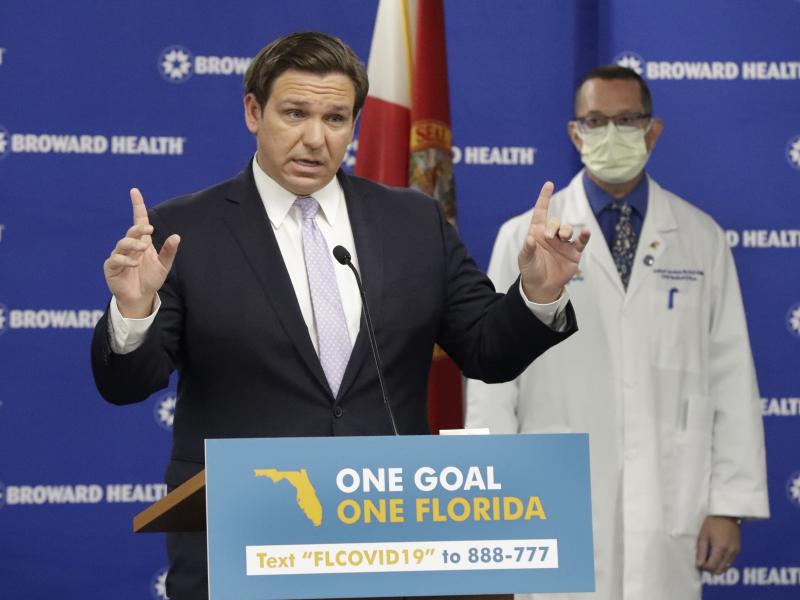 Florida Gov. Ron DeSantis, left, speaks during a news conference along with Dr. Joshua Lenchus, chief medical officer of Broward Health Medical Center on Monday. The number of patients in Florida hospitals for COVID-19 was relatively stable, at just below Florida Gov. Ron DeSantis, left, speaks during a news conference along with Dr. Joshua Lenchus, chief medical officer of Broward Health Medical Center on Monday. The number of patients in Florida hospitals for COVID-19 was relatively stable, at just below
