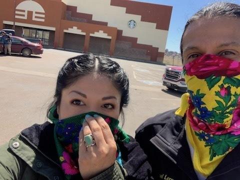 Adrian Lerma, and her husband Michael, stand outside the grocery store in Window Rock, Ariz. They're buying food for elders in their community. Adrian Lerma, and her husband Michael, stand outside the grocery store in Window Rock, Ariz. They're buying food for elders in their community.