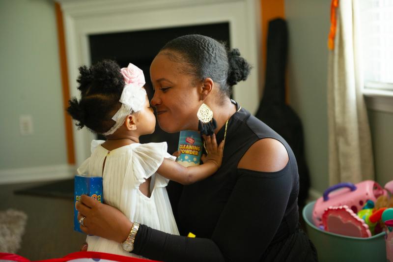 Brittany Smith and her daughter at their home. The family has flourished in Charlotte. Two years ago, Smith and her husband bought a custom-built house and both found new work opportunities. Brittany Smith and her daughter at their home. The family has flourished in Charlotte. Two years ago, Smith and her husband bought a custom-built house and both found new work opportunities.