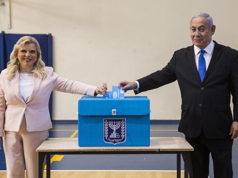 Israeli Prime Minister Benjamin Netanyahu and his wife, Sara, cast their votes at a voting station in Jerusalem on Tuesday. Israeli Prime Minister Benjamin Netanyahu and his wife, Sara, cast their votes at a voting station in Jerusalem on Tuesday.