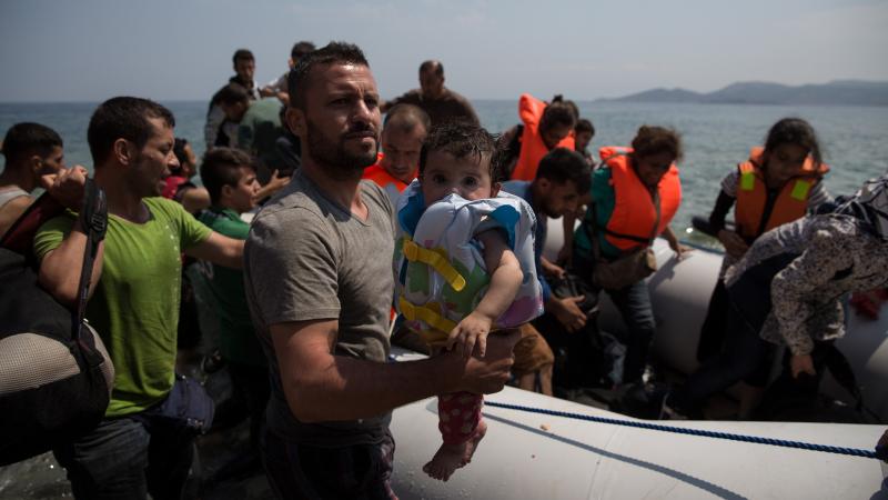 Migrants arrive Monday on the Greek island of Chios, where residents have been assisting the new arrivals. Migrants arrive Monday on the Greek island of Chios, where residents have been assisting the new arrivals.