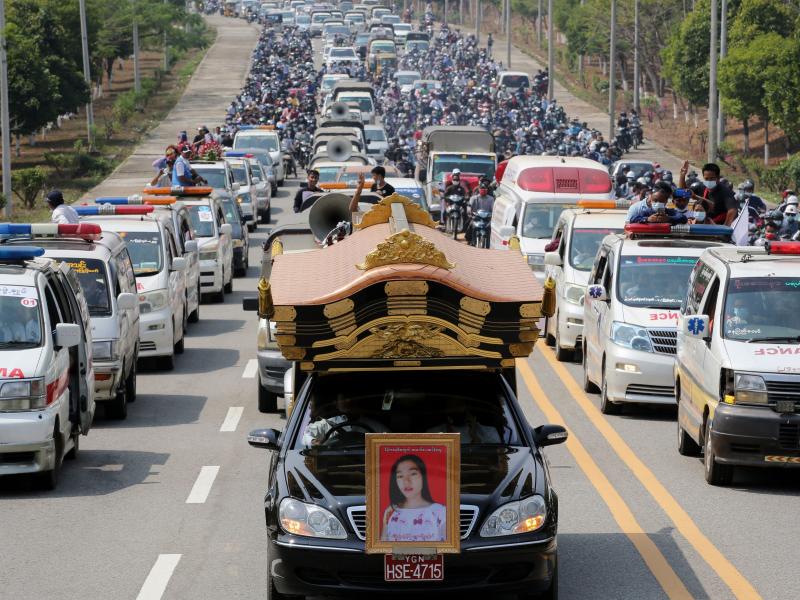 A car carrying the body of protester Mya Thwet Thwet Khine is pictured at the head of a convoy during her funeral service Sunday in Naypyitaw. She was the first confirmed fatality in the ongoing protests against the military coup. A car carrying the body of protester Mya Thwet Thwet Khine is pictured at the head of a convoy during her funeral service Sunday in Naypyitaw. She was the first confirmed fatality in the ongoing protests against the military coup.