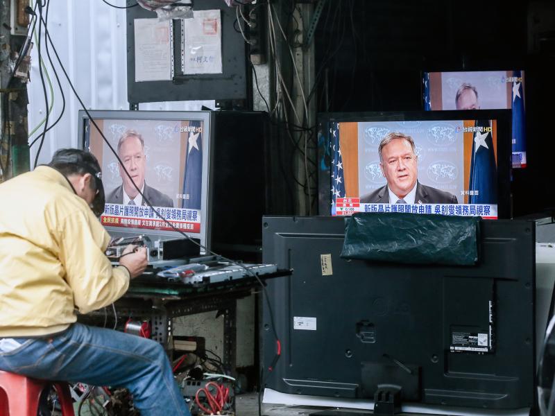 Televisions show a news broadcast of U.S. Secretary of State Mike Pompeo in Taipei, Taiwan, on Jan. 11. The Trump administration removed decades-old restrictions on interactions with Taiwanese officials just days before President-elect Joe Biden's inaugur Televisions show a news broadcast of U.S. Secretary of State Mike Pompeo in Taipei, Taiwan, on Jan. 11. The Trump administration removed decades-old restrictions on interactions with Taiwanese officials just days before President-elect Joe Biden's inaugur