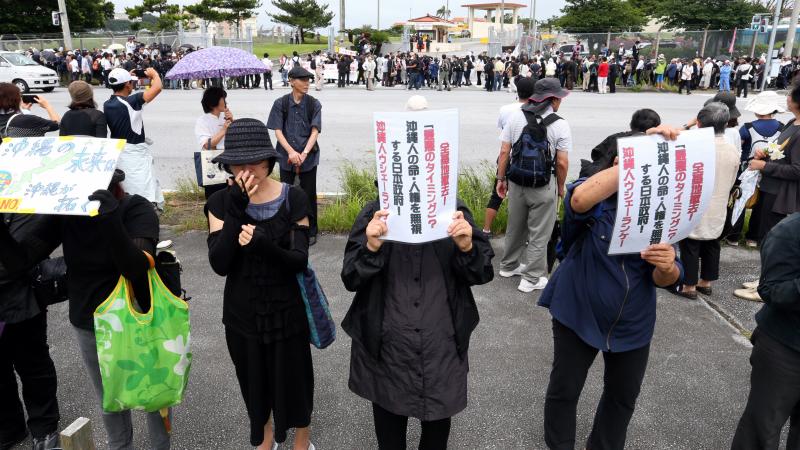 Demonstrators gather in a silent rally to mourn the death of an Okinawa woman in front of Camp Zukeran on May 22. The crime is thrusting the opposition to the U.S. presence on Okinawa back in the spotlight. Demonstrators gather in a silent rally to mourn the death of an Okinawa woman in front of Camp Zukeran on May 22. The crime is thrusting the opposition to the U.S. presence on Okinawa back in the spotlight.