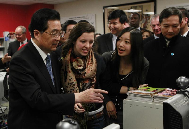 In this 2011 photo, Hu Jintao, then China's president, visits the Confucius Institute at the Walter Payton College Preparatory High School in Chicago. China established more than 100 Confucius Institutes, which provide language and culture programs, at U. In this 2011 photo, Hu Jintao, then China's president, visits the Confucius Institute at the Walter Payton College Preparatory High School in Chicago. China established more than 100 Confucius Institutes, which provide language and culture programs, at U.