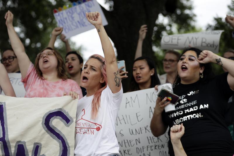 A group gathers at the state capitol in Austin, Texas, in May to protest abortion restrictions. In defiance of the state's ban on city funding of abortion providers, the Austin City Council has found a workaround to help women seeking the procedure. A group gathers at the state capitol in Austin, Texas, in May to protest abortion restrictions. In defiance of the state's ban on city funding of abortion providers, the Austin City Council has found a workaround to help women seeking the procedure.