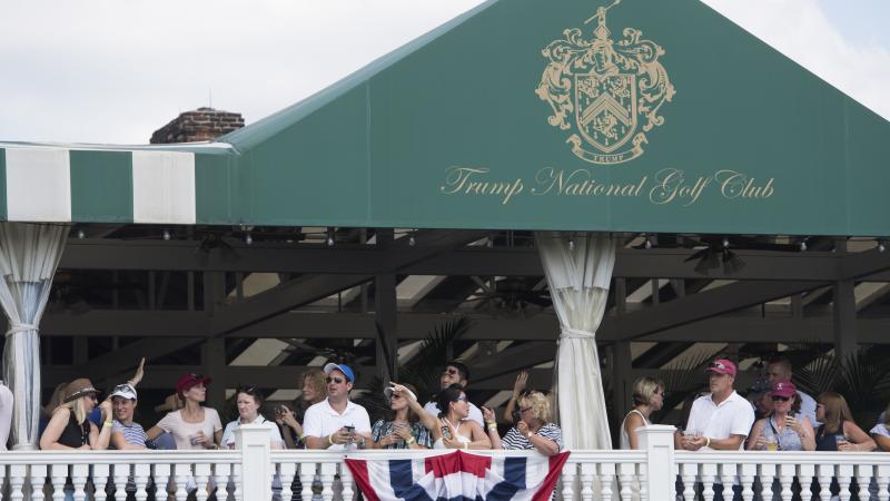 People attend the 72nd U.S. Women's Open Golf Championship at Trump National Golf Course in Bedminster, N.J., in July. President Trump mentioned the golf course during a speech before South Korea's National Assembly. People attend the 72nd U.S. Women's Open Golf Championship at Trump National Golf Course in Bedminster, N.J., in July. President Trump mentioned the golf course during a speech before South Korea's National Assembly.