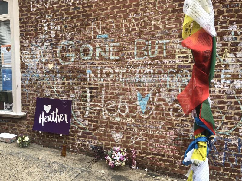 A makeshift memorial on the street where Heather Heyer was killed when a car rammed into a crowd during a white supremacist rally in 2017. A makeshift memorial on the street where Heather Heyer was killed when a car rammed into a crowd during a white supremacist rally in 2017.