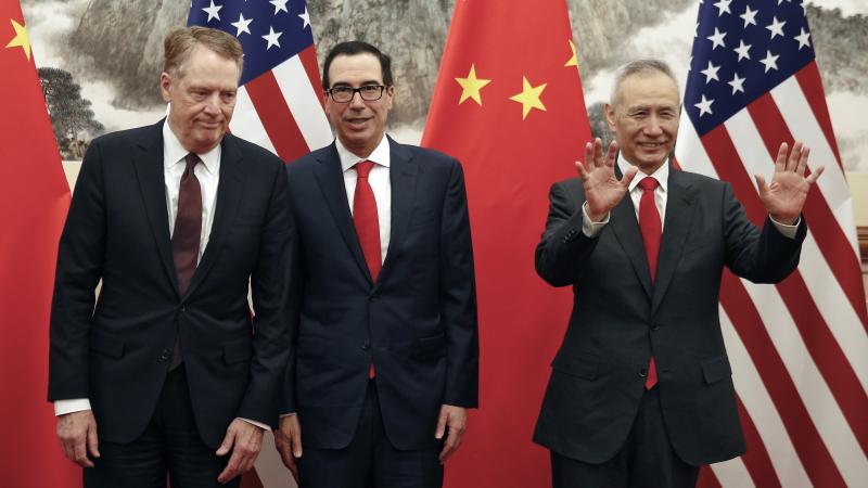 U.S. Trade Representative Robert Lighthizer (from left), U.S. Treasury Secretary Steven Mnuchin and Chinese Vice Premier Liu He gather for a meeting in Beijing on May 1. They are due to meet again in Shanghai this week. U.S. Trade Representative Robert Lighthizer (from left), U.S. Treasury Secretary Steven Mnuchin and Chinese Vice Premier Liu He gather for a meeting in Beijing on May 1. They are due to meet again in Shanghai this week.