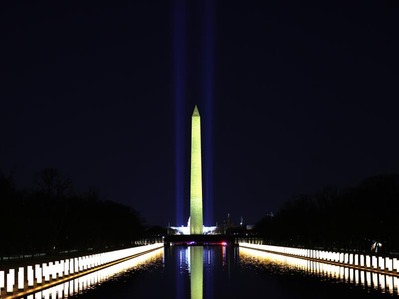 Columns along the sides of the Lincoln Memorial Reflecting Pool pay tribute to victims of COVID-19 at a Jan. 19 memorial. Just over a month later, a Monday evening ceremony will pay tribute to 500,000 Americans lives lost. Columns along the sides of the Lincoln Memorial Reflecting Pool pay tribute to victims of COVID-19 at a Jan. 19 memorial. Just over a month later, a Monday evening ceremony will pay tribute to 500,000 Americans lives lost.