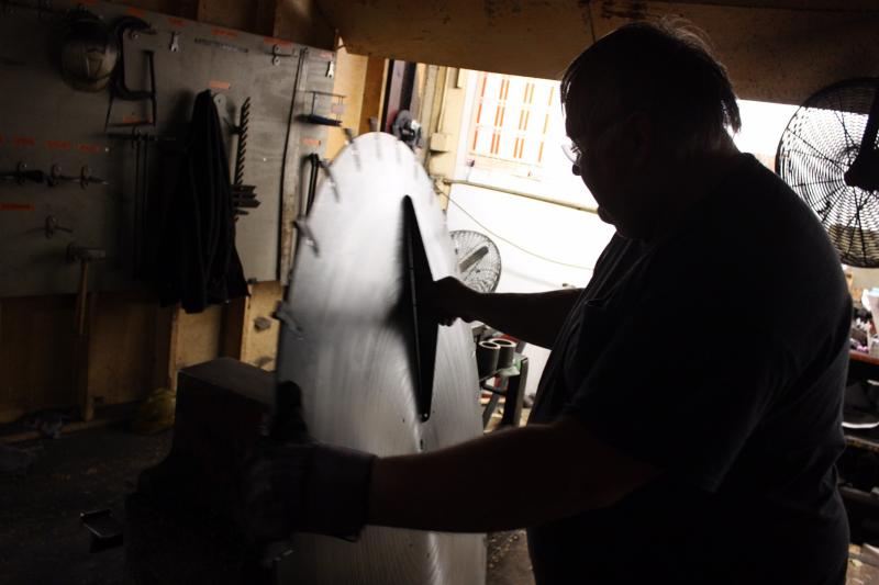A worker checks a finished saw blade at the Simonds International plant. The plant employs 80 people and may suffer under President Trump's proposed tariffs on imported steel. A worker checks a finished saw blade at the Simonds International plant. The plant employs 80 people and may suffer under President Trump's proposed tariffs on imported steel.