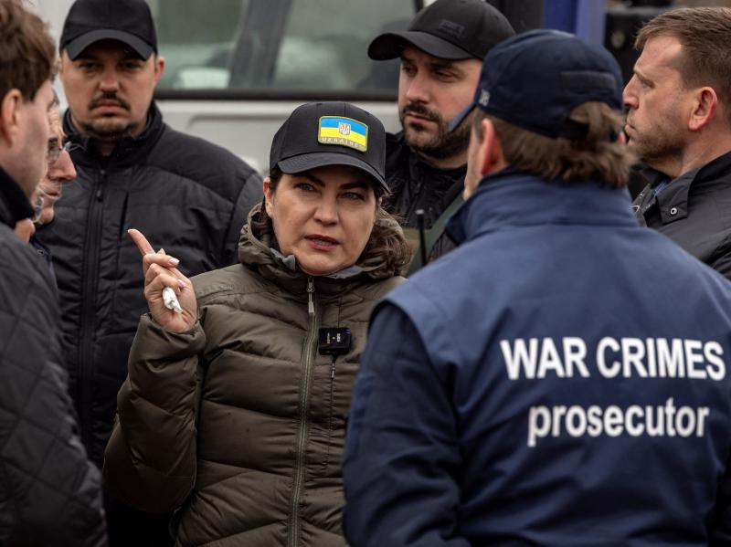 Ukraine's Prosecutor General Iryna Venediktova visits a mass grave in Bucha, on the outskirts of Kyiv, on April 13, 2022. The International Criminal Court's chief prosecutor to Bucha visited as the front in Russia's invasion shifted eastward and new alleg Ukraine's Prosecutor General Iryna Venediktova visits a mass grave in Bucha, on the outskirts of Kyiv, on April 13, 2022. The International Criminal Court's chief prosecutor to Bucha visited as the front in Russia's invasion shifted eastward and new alleg