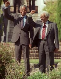 Nelson Mandela and Walter Sisulu raise their fists in 1990, one day after Mandela was released from jail. Nelson Mandela and Walter Sisulu raise their fists in 1990, one day after Mandela was released from jail.