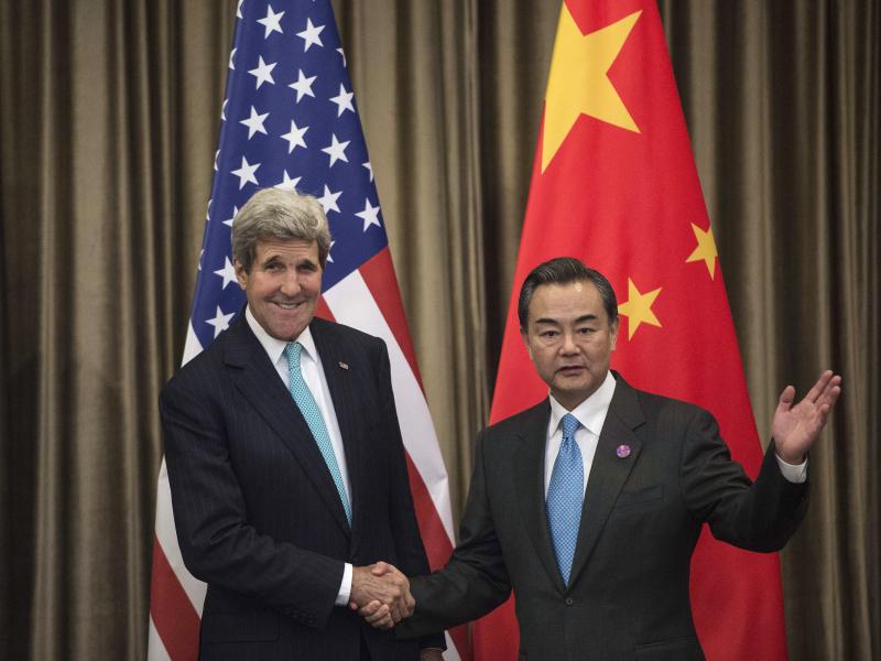 Secretary of State John Kerry and Chinese Foreign Minister Wang Yi meet on the sidelines of the Asia-Pacific Economic Cooperation (APEC) meeting in Beijing on Friday. Beijing and Washington backed an anti-corruption pact. Secretary of State John Kerry and Chinese Foreign Minister Wang Yi meet on the sidelines of the Asia-Pacific Economic Cooperation (APEC) meeting in Beijing on Friday. Beijing and Washington backed an anti-corruption pact.
