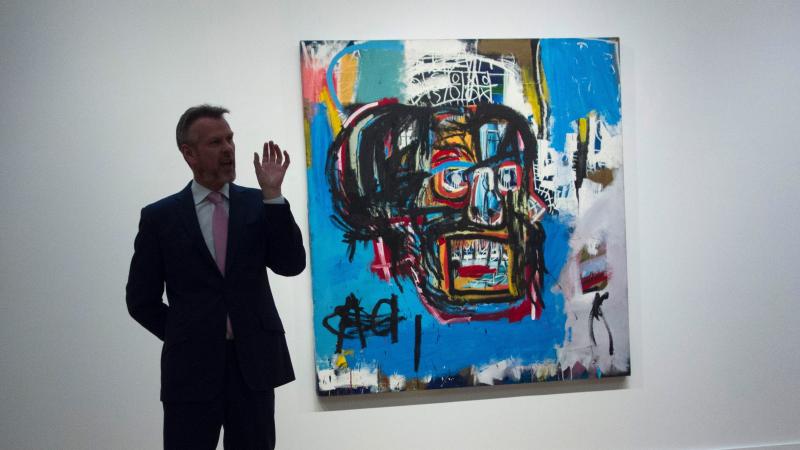 Jean-Michel Basquiat's untitled painting of a skull is displayed behind an official with Sotheby's, which offered the media a preview earlier this month. On Thursday, the work sold for $110.5 million — the highest sum ever paid at auction for a work by Jean-Michel Basquiat's untitled painting of a skull is displayed behind an official with Sotheby's, which offered the media a preview earlier this month. On Thursday, the work sold for $110.5 million — the highest sum ever paid at auction for a work by