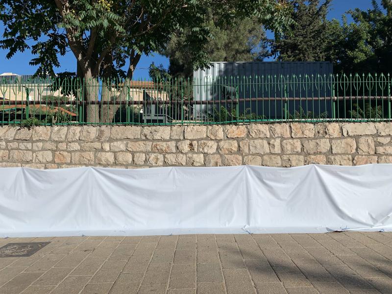 A pro-LGBTQ banner is flipped over on a wall outside the U.S. Embassy in downtown Jerusalem. A pro-LGBTQ banner is flipped over on a wall outside the U.S. Embassy in downtown Jerusalem.