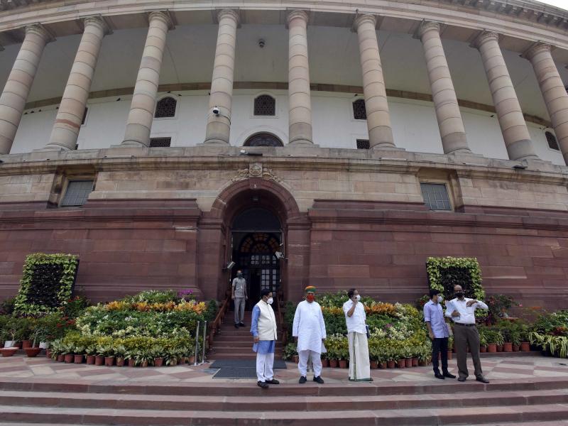 Politicians gathered at India's Parliament House ahead of the first session in six months, on Sept. 13 in New Delhi. Lawmakers were required to get tested for the coronavirus within 72 hours before entering parliament. Politicians gathered at India's Parliament House ahead of the first session in six months, on Sept. 13 in New Delhi. Lawmakers were required to get tested for the coronavirus within 72 hours before entering parliament.