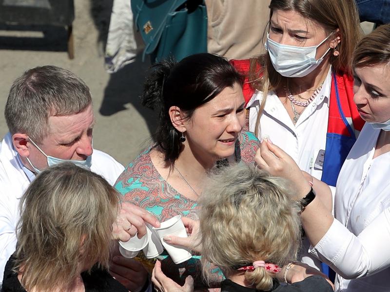 Relatives of students who attend a school in the Russian city of Kazan, where a gunman opened fire on Tuesday, killing several students and at least one teacher and injuring more than 20 others. Relatives of students who attend a school in the Russian city of Kazan, where a gunman opened fire on Tuesday, killing several students and at least one teacher and injuring more than 20 others.