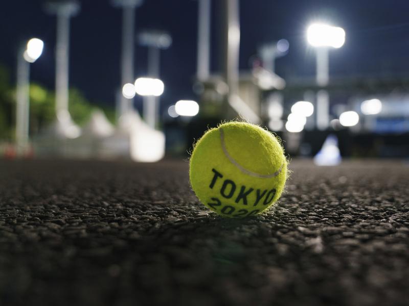 A ball sits outside a court at the Ariake Tennis Park during practice sessions at the Tokyo Olympics on Tuesday. A ball sits outside a court at the Ariake Tennis Park during practice sessions at the Tokyo Olympics on Tuesday.