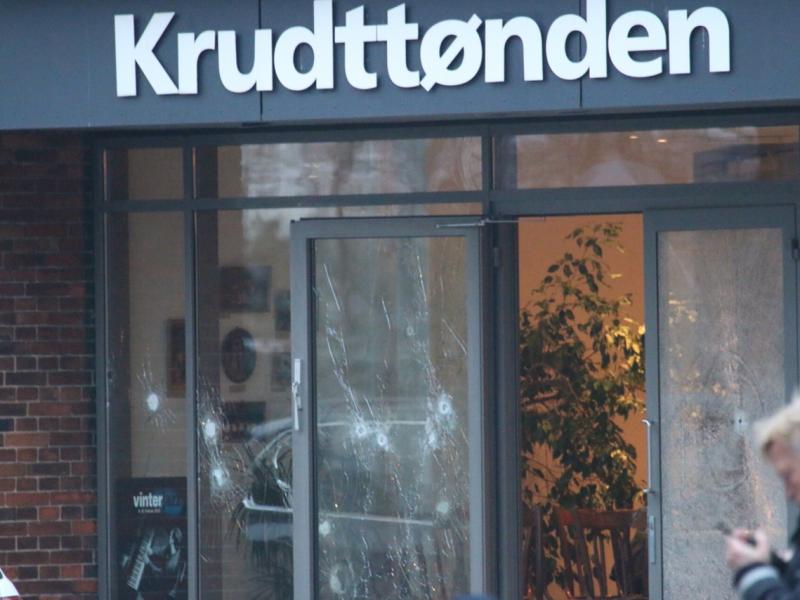 Damaged glass is seen at the site of a shooting in Copenhagen on Saturday. Shots were fired near a meeting in the Danish capital that was attended by controversial Swedish artist Lars Vilks. Damaged glass is seen at the site of a shooting in Copenhagen on Saturday. Shots were fired near a meeting in the Danish capital that was attended by controversial Swedish artist Lars Vilks.