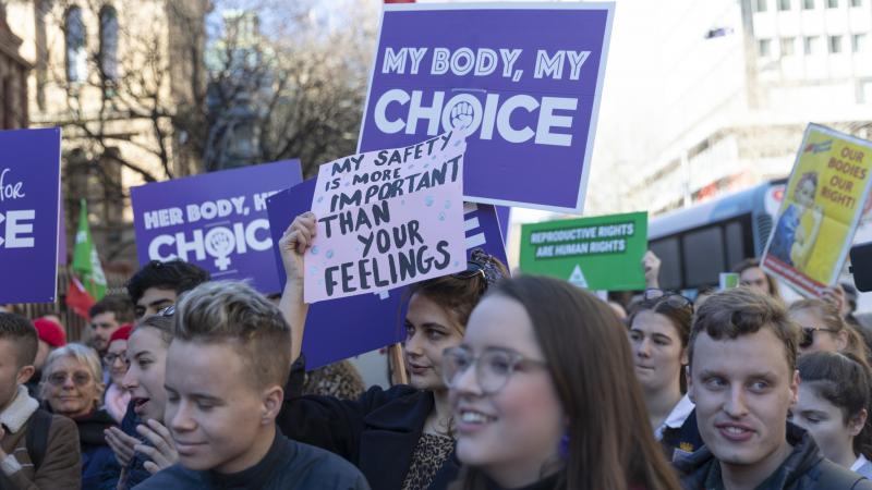Residents of Sydney attend a rally last month at Parliament House in support of decriminalizing abortion. Residents of Sydney attend a rally last month at Parliament House in support of decriminalizing abortion.