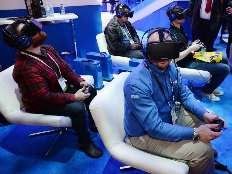 Attendees wear Oculus Rift HD virtual reality headsets at the Consumer Electronics Show in January. Attendees wear Oculus Rift HD virtual reality headsets at the Consumer Electronics Show in January.