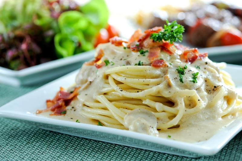 Pasta Carbonara is made with spaghetti, eggs, cheese and pork. Pasta Carbonara is made with spaghetti, eggs, cheese and pork.